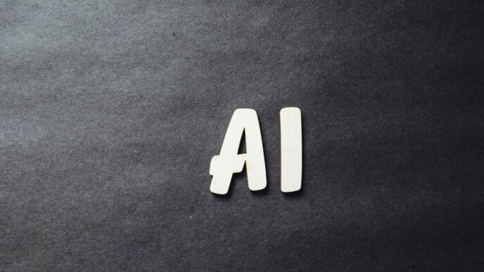 the word ai spelled in white letters on a black surface