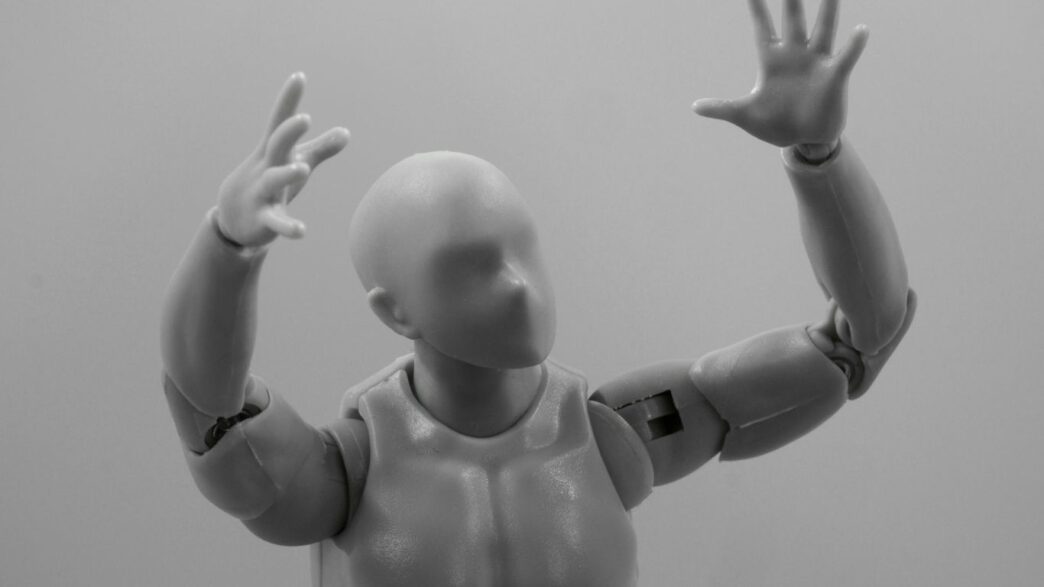 baby in white diaper lying on white textile