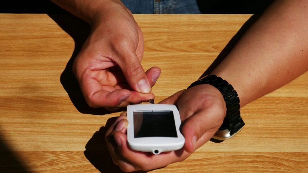 a person holding a smart phone in their hands