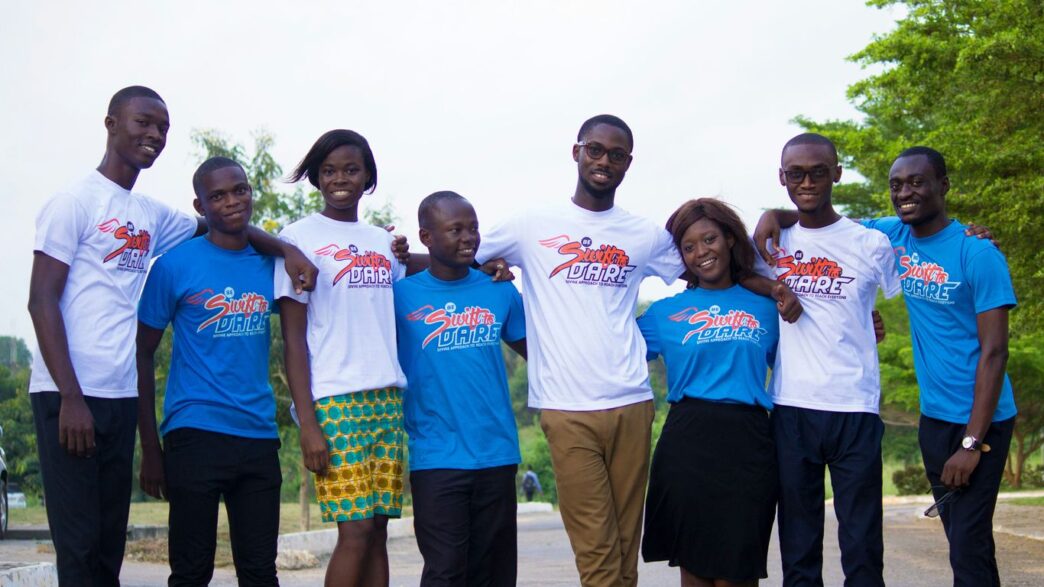 group of people standing on gray concrete floor during daytime