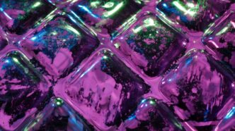 Close up of purple and green textured surface.