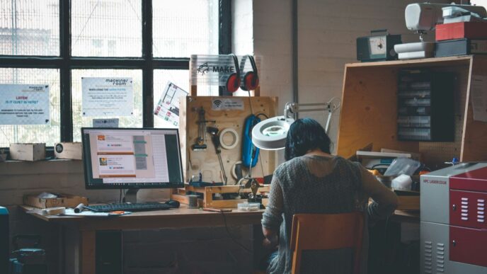 woman sitting in front of a wooden desk