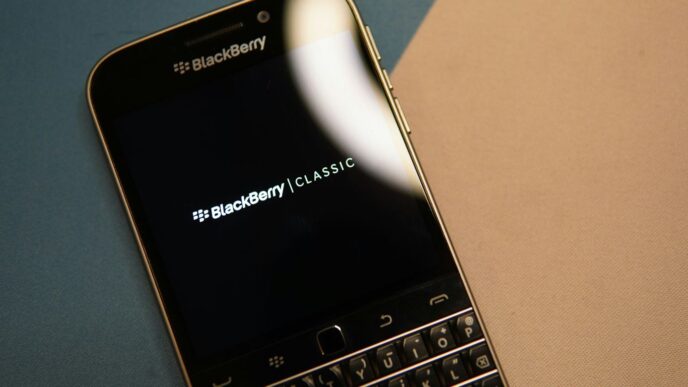 black and silver blackberry qwerty phone
