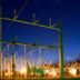 green and grey transmission tower during nighttime