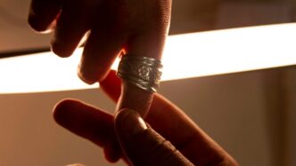 a close-up of a hand holding a light bulb
