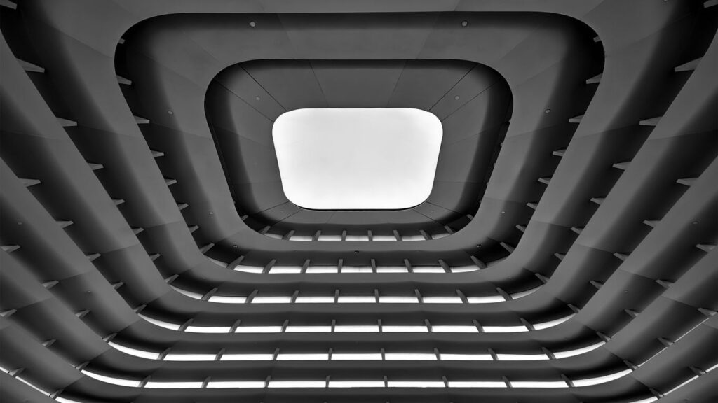 A black and white photo of a ceiling