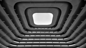 A black and white photo of a ceiling