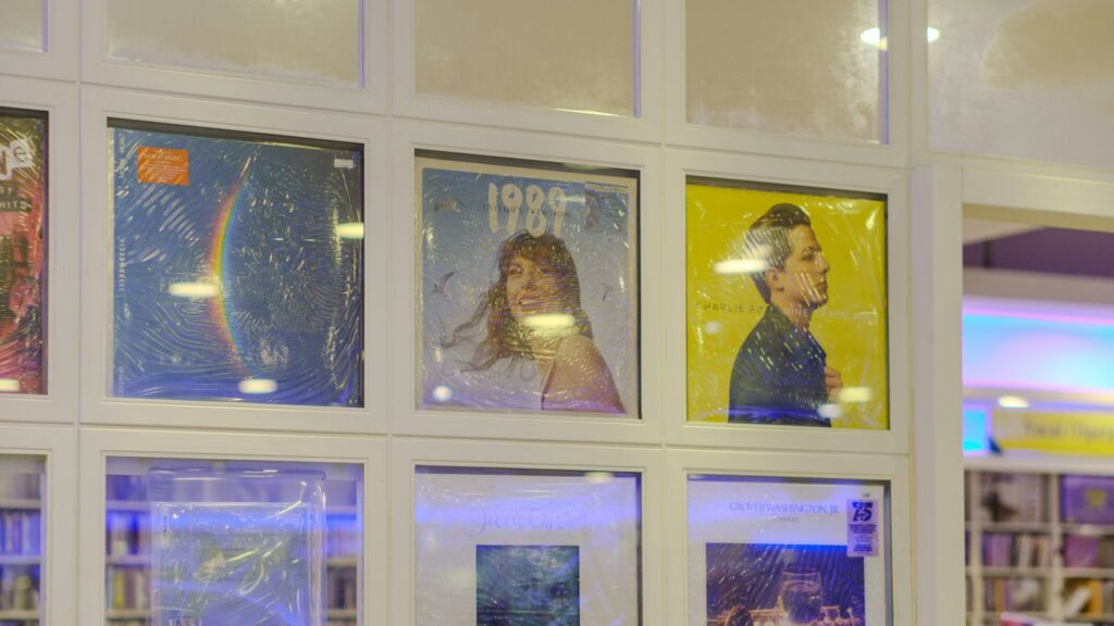 Framed posters displayed in a grid on a wall