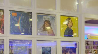 Framed posters displayed in a grid on a wall