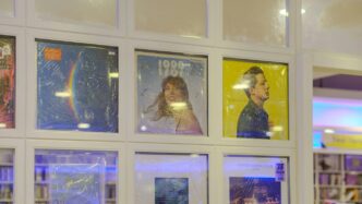 Framed posters displayed in a grid on a wall