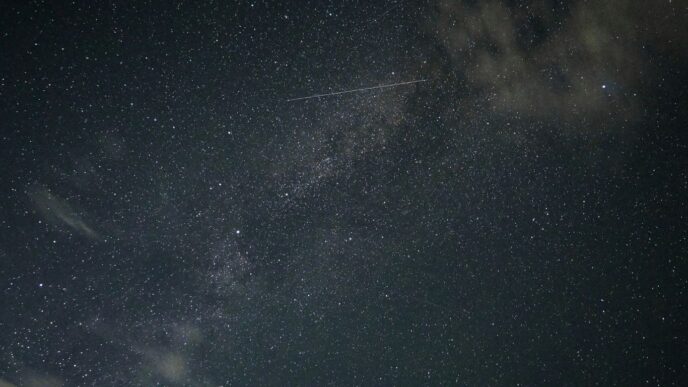 A plane flying through the night sky