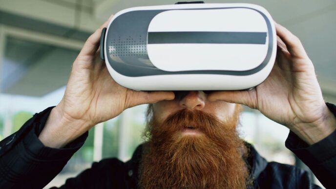 Man with long beard wearing virtual reality headset.