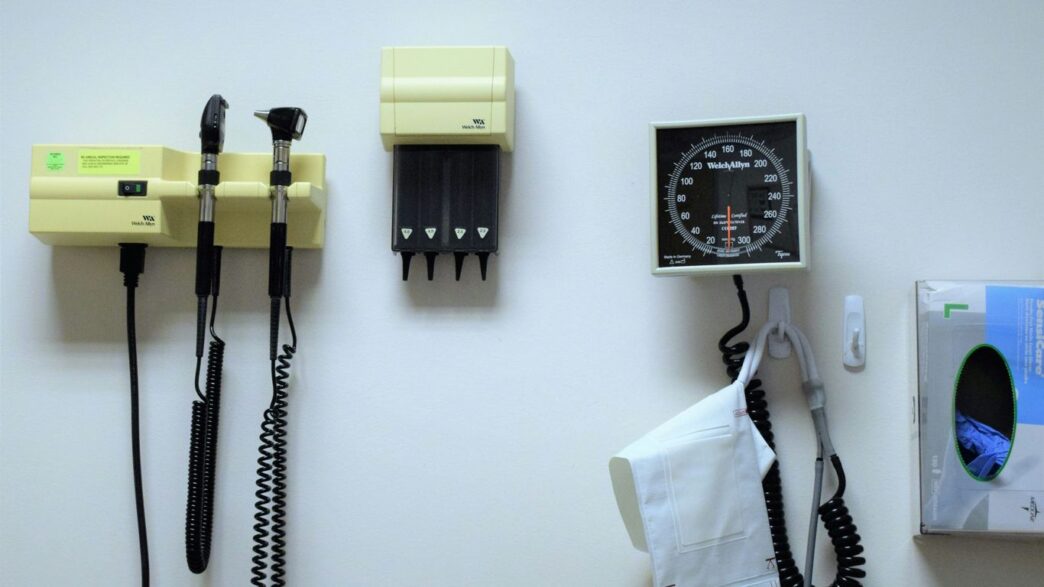 a white wall with a bunch of electrical equipment on it