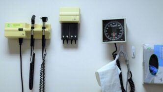 a white wall with a bunch of electrical equipment on it