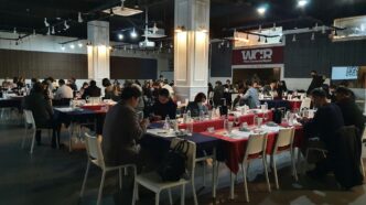 a group of people sitting at tables in a room