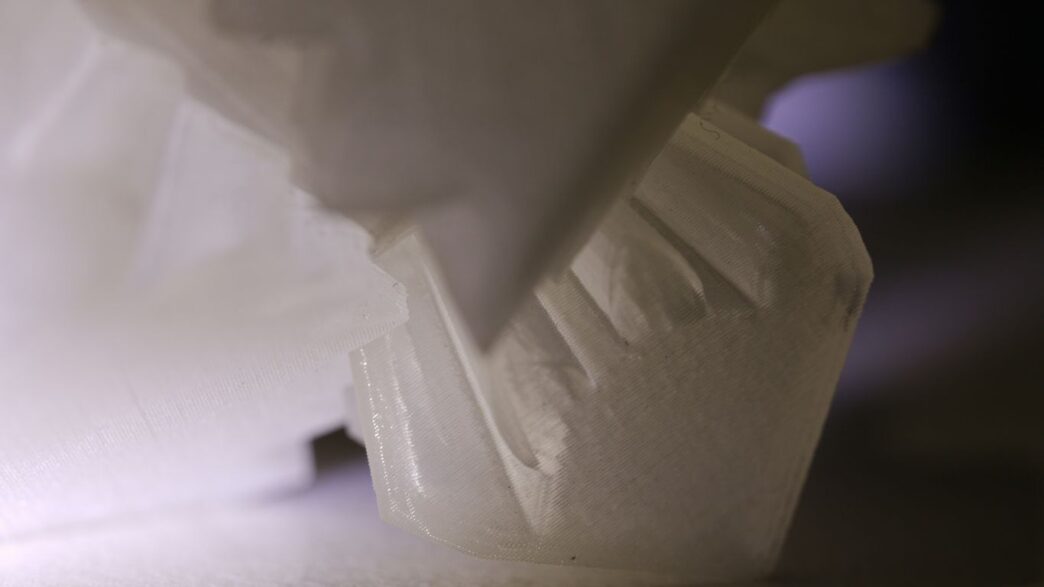 a close up of a white object on a table