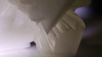 a close up of a white object on a table