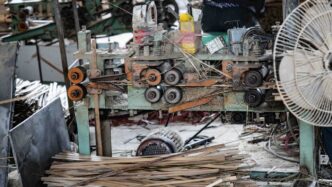 Wood processing machinery with stacked lumber