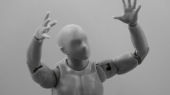 baby in white diaper lying on white textile