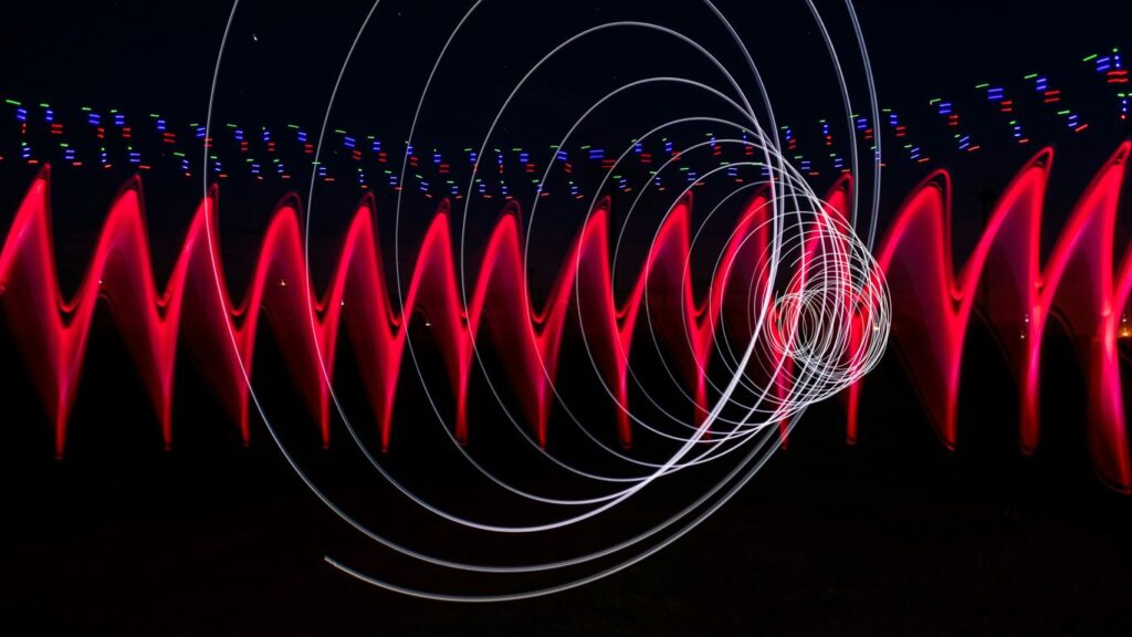 a long exposure photo of red and white lights