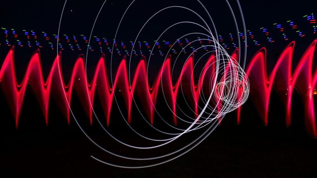 a long exposure photo of red and white lights