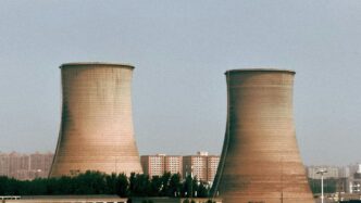 Cooling towers of a power plant are depicted.