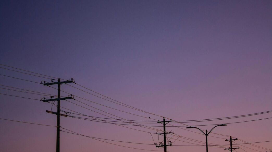 A row of telephone poles sitting next to each other
