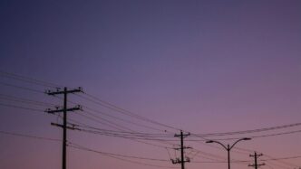 A row of telephone poles sitting next to each other