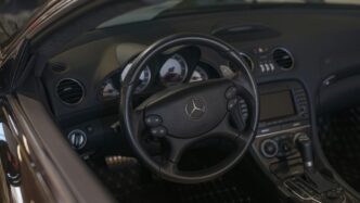 Mercedes-benz car interior with leather steering wheel.