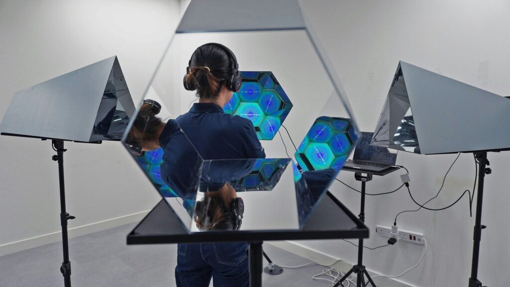 a man standing in front of a mirror in a room