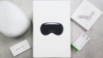 Virtual reality headset packaging and accessories on a surface.