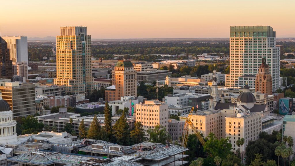 Cityscape with tall buildings at sunset