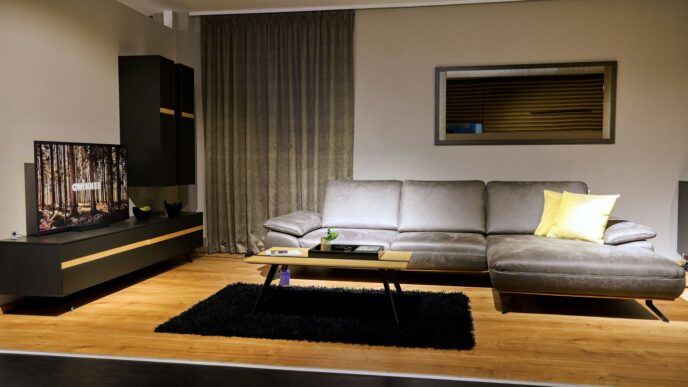 a living room filled with furniture and a flat screen tv