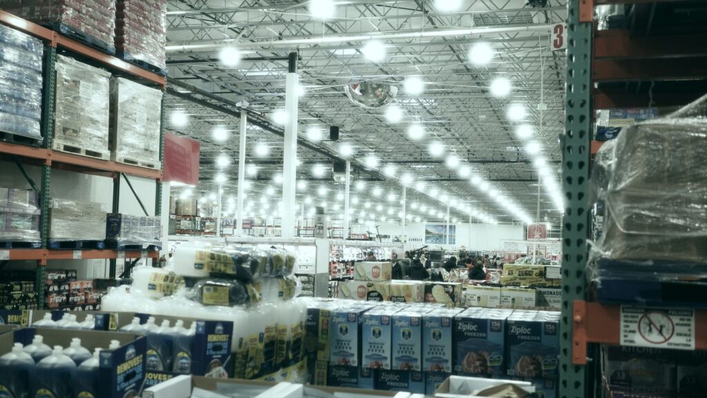 A wide aisle in a brightly lit warehouse store.