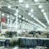 A wide aisle in a brightly lit warehouse store.