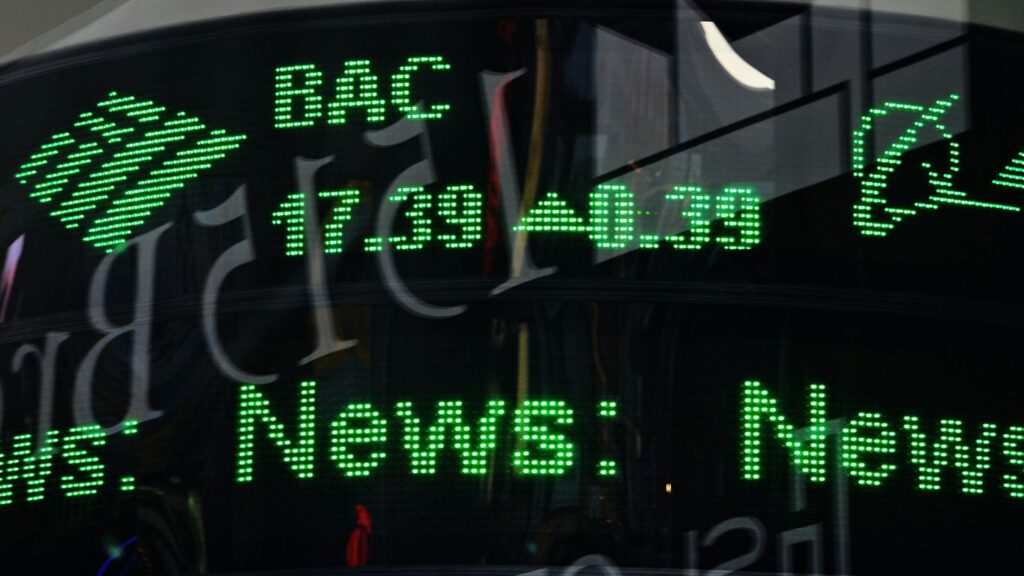 a close up of a clock with green numbers