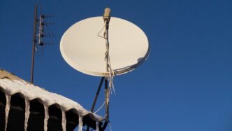 A satellite dish sitting on top of a roof