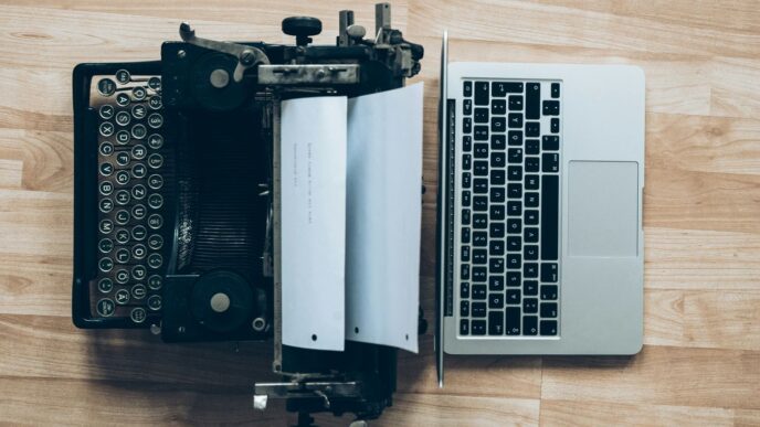gray typewriter and MacBook