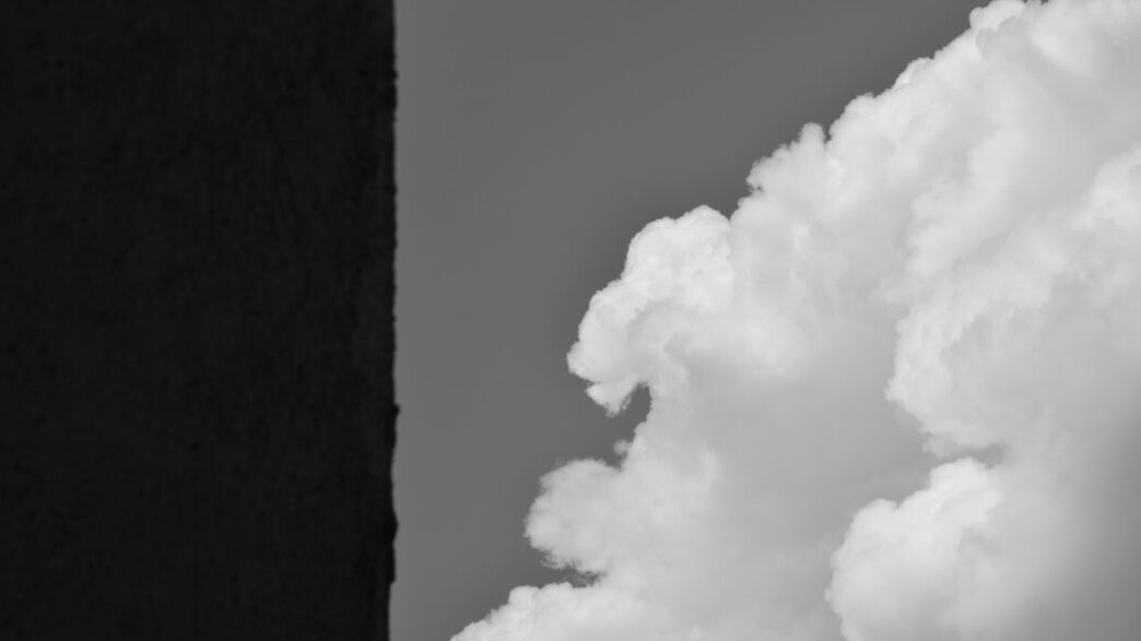 A black and white photo of clouds in the sky