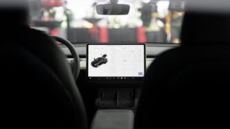 a car dashboard with a laptop on it