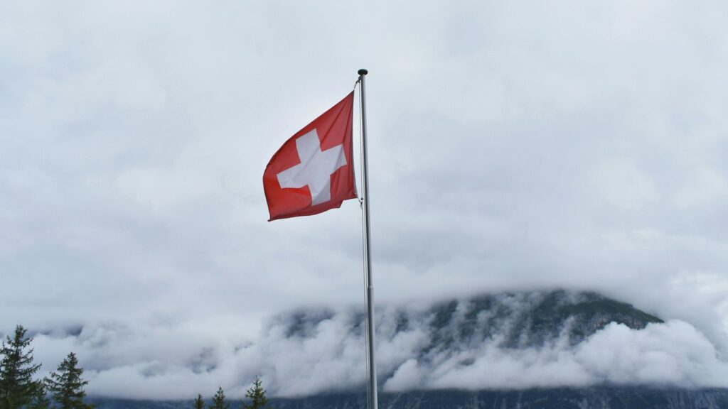 Switzerland flag during cloudy day