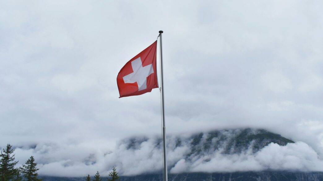 Switzerland flag during cloudy day
