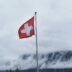 Switzerland flag during cloudy day