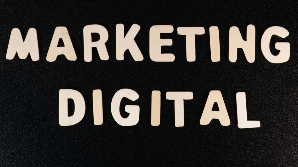 the words marketing and digital written on a black surface