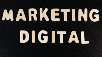 the words marketing and digital written on a black surface
