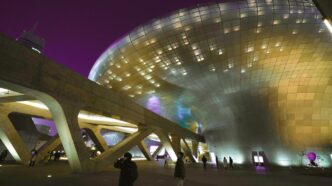 Modern building with illuminated facade at night