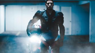 man wearing black safety gear inside well lit room