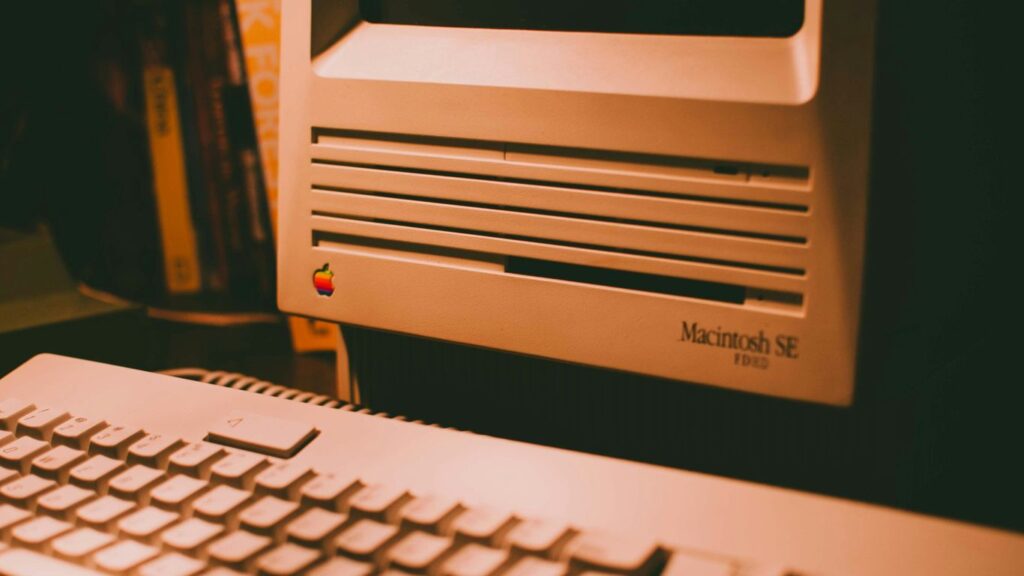 white computer keyboard on black table
