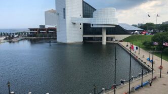 white concrete building near body of water during daytime