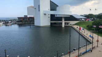 white concrete building near body of water during daytime